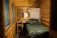 Unique Alaskan log home in trees & wild flowers on 14-acre private homestead.