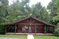 Cozy Cabin in the Woods in a Relaxing Area with Wrap Around Porch Rocking Chairs