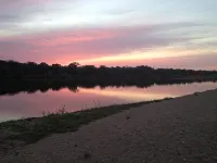 Waterfront, gorgeous sunsets, sandy beach, dogs allowed.