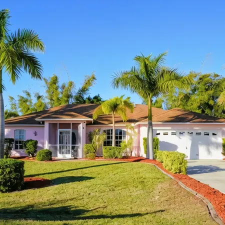 Fenced, private, family friendly villa with exotic poolside views near airport.