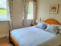 Abhainn Ri Cottages Hotels near St Mary's Church of Ireland