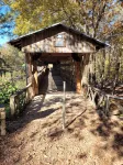 Historic Cabin in a natural setting with waterfalls and covered bridge