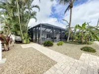 Cute canal front Cottage with dock & boat lift and pool ,short walk to the beach