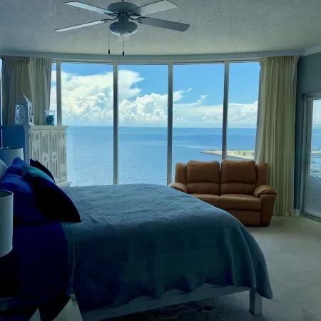 Floor to Ceiling Windows Overlook the Gulf of America's Pristine White Beaches