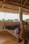 Dive in to our pool and feel the breeze at Mbibo House in the Shela sand dunes - Homestays