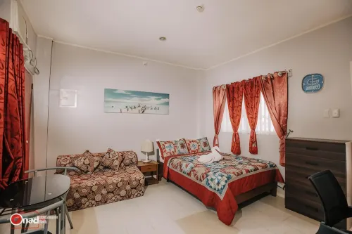 Ashley and Bill's Suites 'n Garden Hotel and Vacation Homes Hôtels à : Pinamungahan