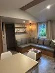 Your mobile home with covered terrace and barbecue is waiting for you this summer.