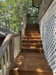 Peaceful lake front home with wrap around porch and relaxing views!