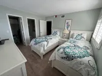 End unit with extra windows. Steps to the beach, private beach access!