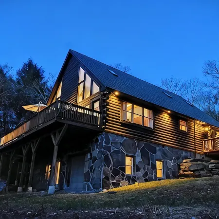 Secluded modern log cabin with picturesque private water fall on 12 acres!