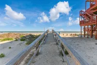 Luxury Beachfront Condo with Covered Deck Steps From Beach & Golf Cart Rental - 4-Star
