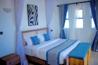 4-bedroom villa in enchanting Pazuri in Kilifi County with AC, WiFi - วิลล่า
