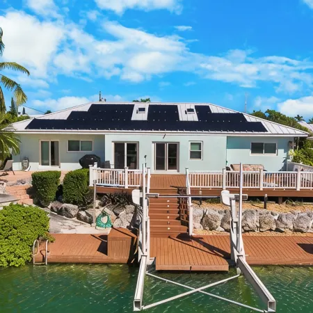 Waterfront Home with a Large Dock, Pool, and Deck Area. Can Accommodate Pets.