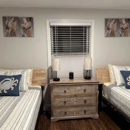 This Two-Bedroom Cottage Features One Queen Bed, Two Twin Beds, and a Sofa Bed.