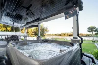 Lakefront Retreat w/Hot Tub, Arcade & Sunset Views - 4-Star