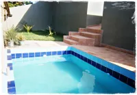 Suítes de Setiba - Hospedaria Oca Ruca