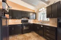 Monterey craftsman style home with vaulted exposed-beams ceiling hardwood floor