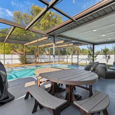 Charming 2-bedroom house with pool and fenced in backyard. Sleeps 8