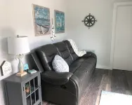 Charming shipping container home with lake view and boat ramp.