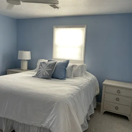 Located directly on canal w/ beautiful water front views — one block from beach