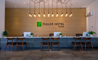 "a hotel lobby with a reception desk , chairs , and a large green sign reading "" fuller hotel "" on the wall" at Fuller Hotel Kulim
