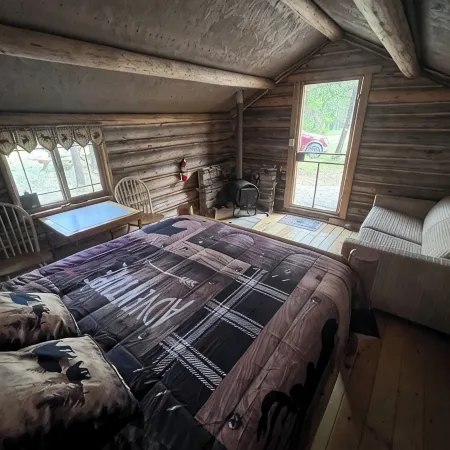 Retreat to our cozy cabin nestled in a private hideaway.Solar lights & shower