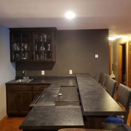 Three bedroom hide-a-way with spacious deck over looking Island Lake.