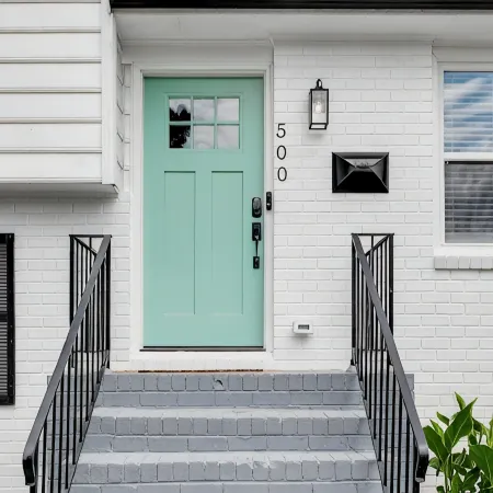 Stylish 4 bedroom house with outdoor dining and fenced backyard.