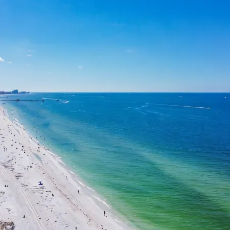 4-Bed Coastal Retreat: Heated Pool, 200 Steps to Beach, Walk to Fun!