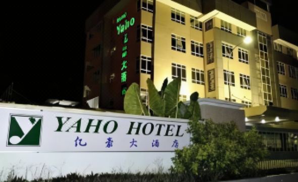 "a building with the word ""hotel"" on it at night is actually an apartment complex" at Golden Hotel