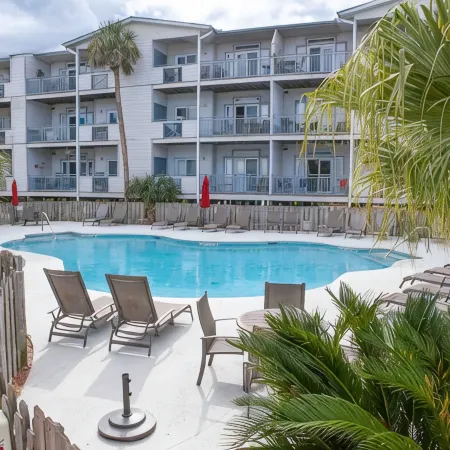 Oceanfront Condo with beautiful Sunsets - Dolphins, Pools, and family fun