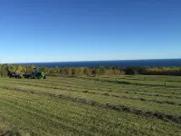 A view of Lake Superior set in the middle of a working farm