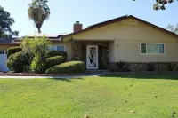 Beautiful Home in quiet neighborhood with a pool and close to stores & highways.