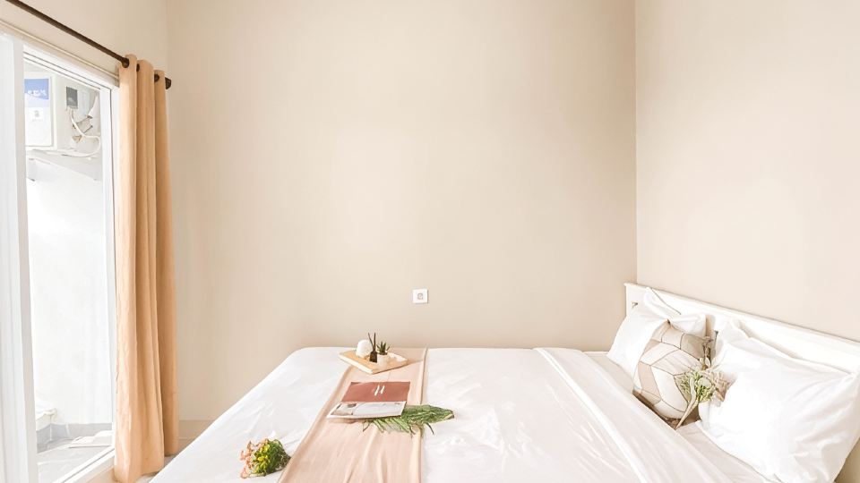Cream Tone 1BR at Royal Sentul Park Apartment By Travelio