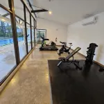 Charming 2-bedroom apartment with WiFi, AC, fitness room and coworking space - gimnasio