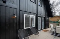 Modern Riverfront A-Frame Cabin w/ Hot Tub, Fire Pit, Kayaks, Canoe, & Arcade
