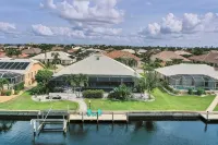 RUM CAY GETAWAY: South facing waterfront home, private pool/spa, bar, and dock.