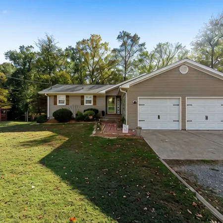 3 bedroom/2 full bath lakefront home with gentle slope to private covered dock