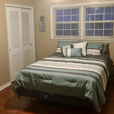 Experience Kentucky Lake out the back door! Spacious 4-bedroom retreat awaits.