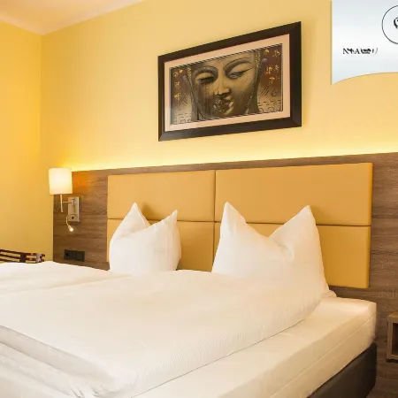 Naam Hotel & Apartments Frankfurt City-Messe Airport Отели рядом с достопримечательностью «Нидеррад»