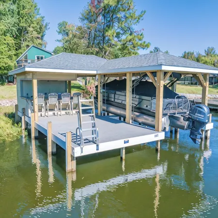 Beautiful lake front cottage, deep water lot with covered dock and amenities.