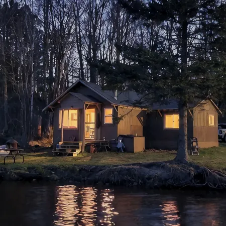 Cozy cabin right on the water! All bikers, skiers, fisherman and more welcome!