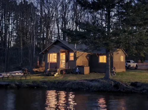 Cozy cabin right on the water! All bikers, skiers, fisherman and more welcome!