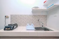 Minimalist and Comfortable Studio Dave Apartment by Travelio