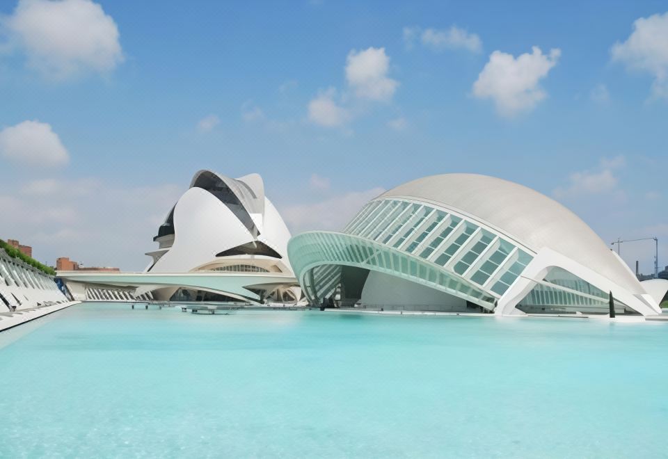 a large body of water with two modern buildings , one white and the other blue at Hotel Albufera