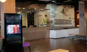 There is an open restaurant on the ground floor with tables, chairs, and a counter in front at The Grand Campbell Hotel Kuala Lumpur