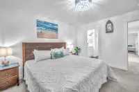Seaside Riverfront Escape • HotTub • Walk to Beach