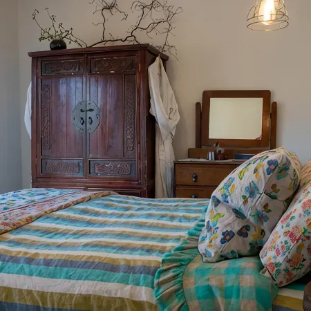 Tree Tops Apt @ Dreamers features log fire, mountain + pool views thru tree tops