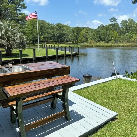 BEAUTIFUL WATERFRONT .  GNAT SCREENED BOATHOUSE AND AJOINING COVERED BOAT SLIPS