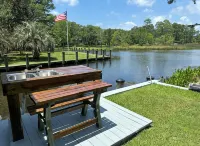 BEAUTIFUL WATERFRONT .  GNAT SCREENED BOATHOUSE AND AJOINING COVERED BOAT SLIPS